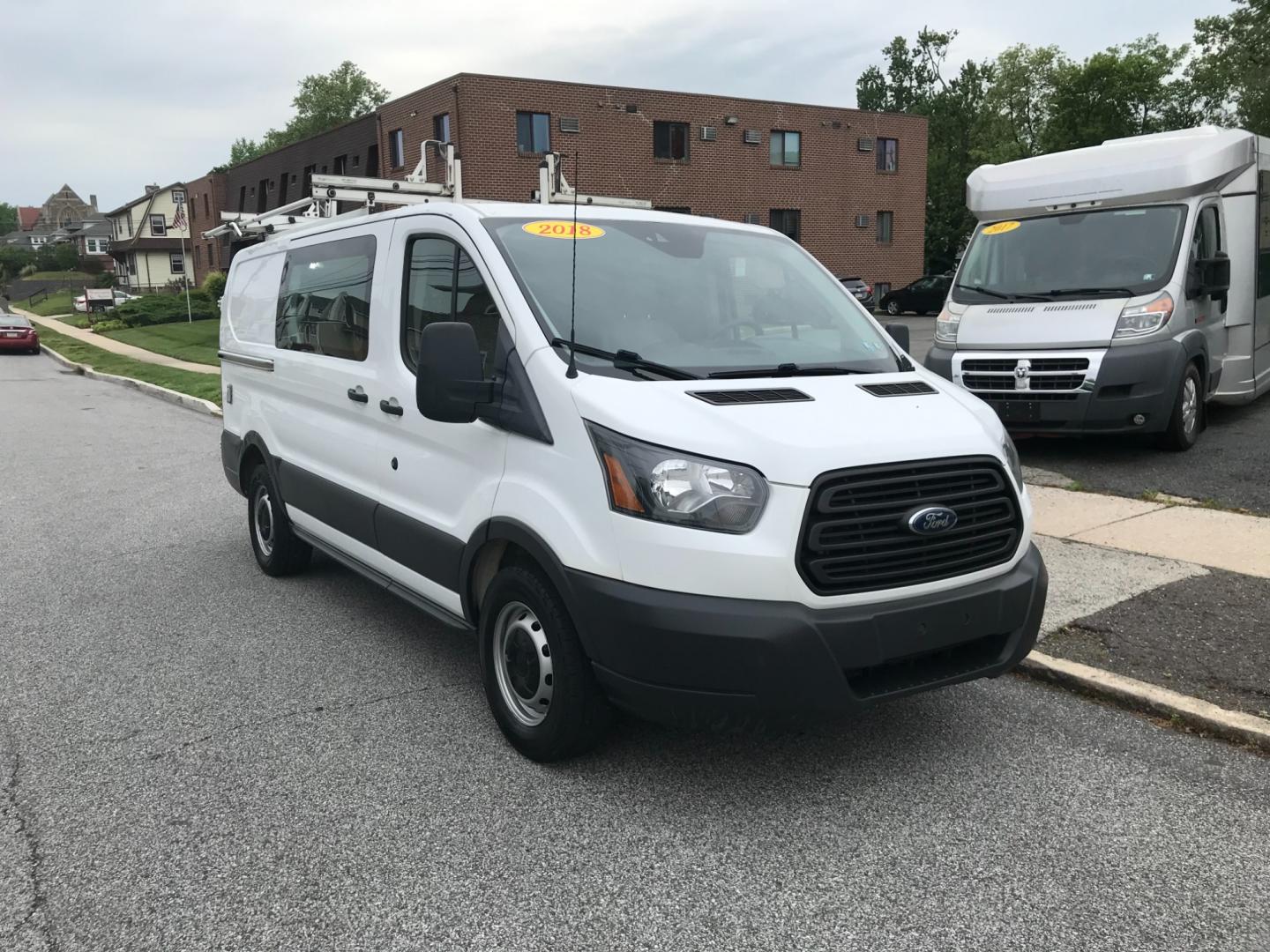 2018 White /Gray Ford Transit 150 (1FTYE1YM1JK) with an 3.7 V6 engine, Automatic transmission, located at 577 Chester Pike, Prospect Park, PA, 19076, (610) 237-1015, 39.886154, -75.302338 - 2018 Ford Transit 150: Dual drop down ladder racks, multiple pieces of shelving, power inverter w/ outlet, heavy duty partition, FLEET MAINTAINED, runs LIKE NEW! This vehicle comes inspected and has been given a bumper to bumper safety check. It is very clean, reliable, and well maintained. We of - Photo#2